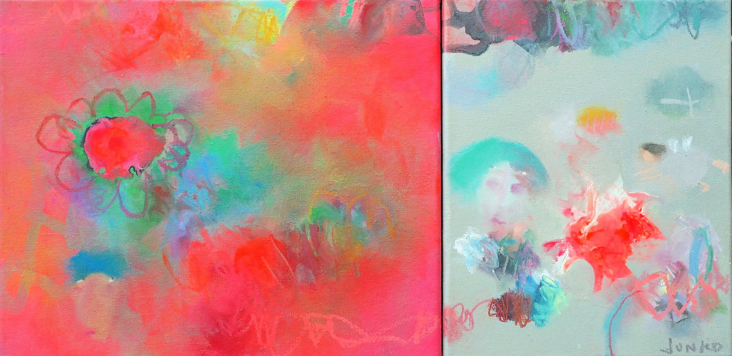 There are fairies in a little pot of growing flowers....