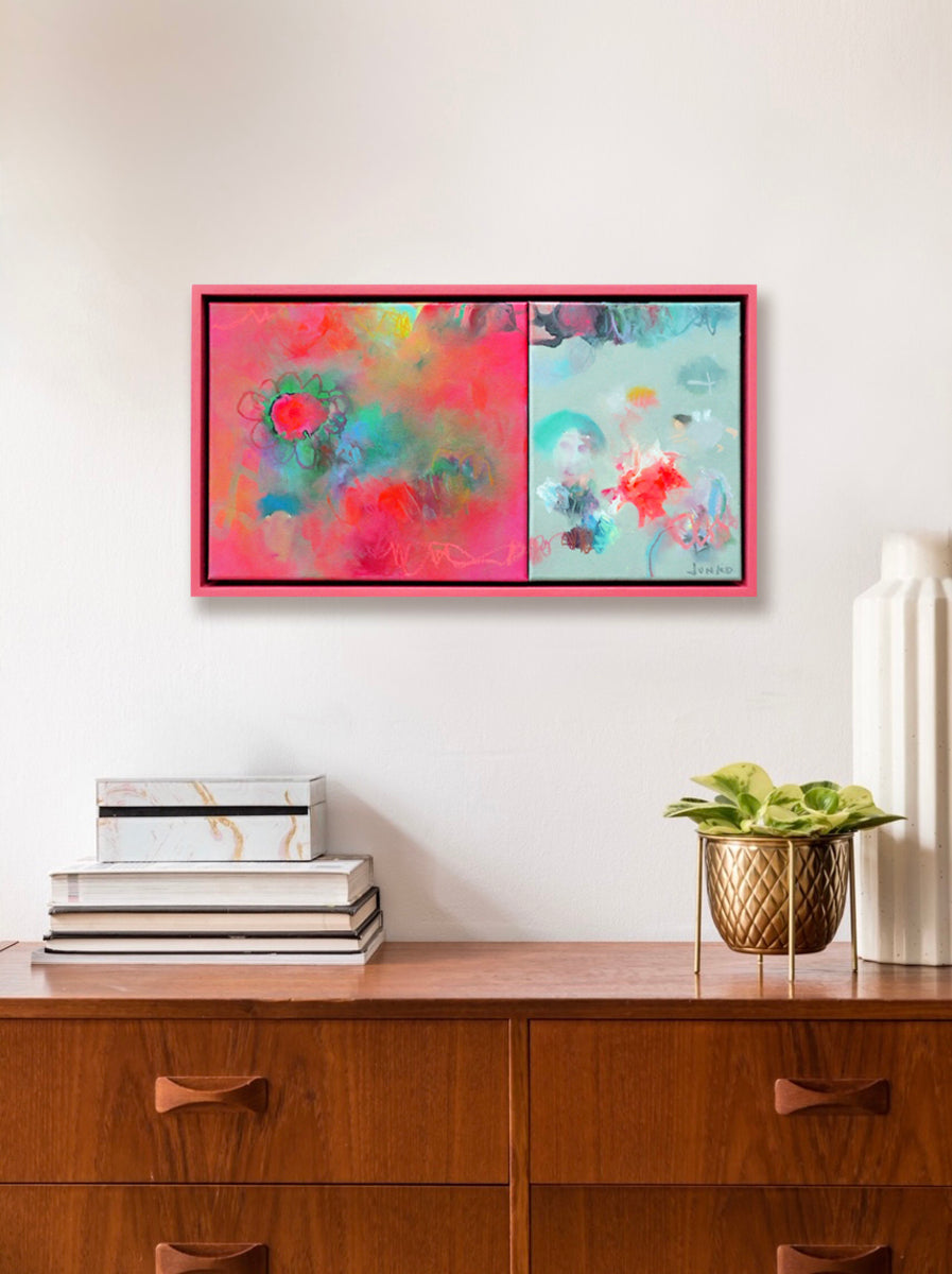 There are fairies in a little pot of growing flowers....