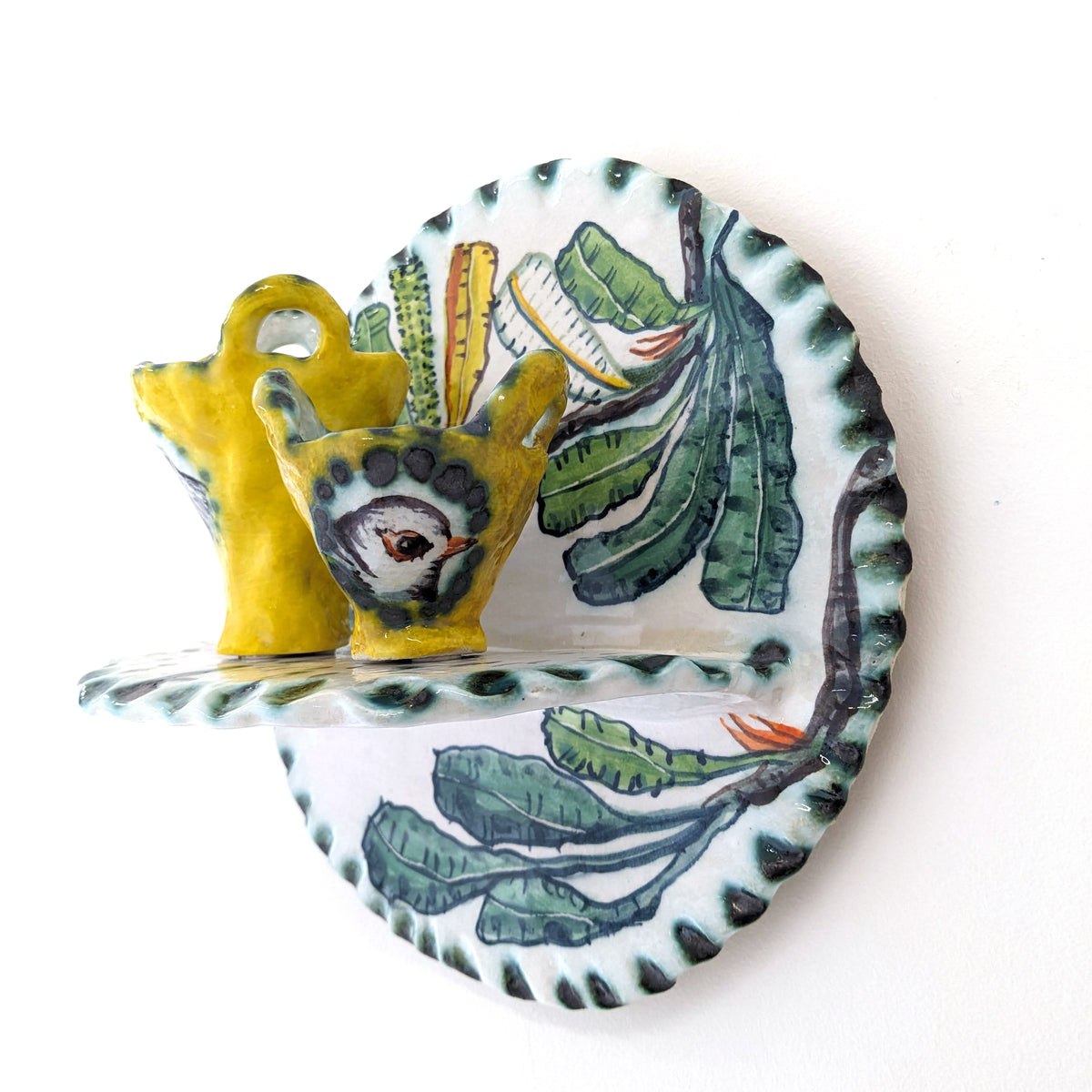 A Fine Balance shelf with yellow cups