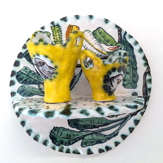 A Fine Balance shelf with yellow cups