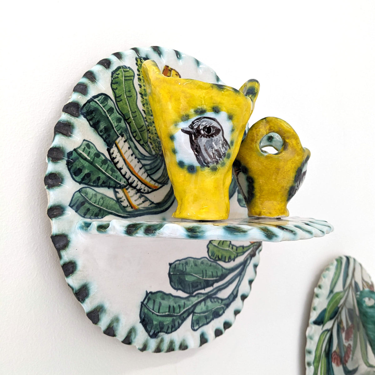 A Fine Balance shelf with yellow cups